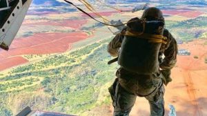Photo of soldier looking at the horizon from a plane illustrates blog "How To Achieve CMMC Level 2 Compliance in 90 Days"