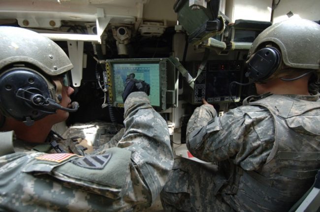Talisman Sabre 2007 Soldiers with helmets and headsets pointing at screen illustrate blog "CMMC for Small Businesses: a Starter Kit"