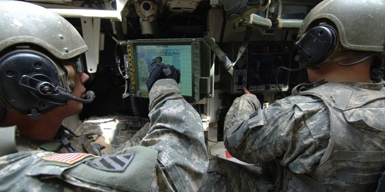 Soldiers with helmets and headsets pointing at screen illustrate blog "CMMC for Small Businesses: a Starter Kit"