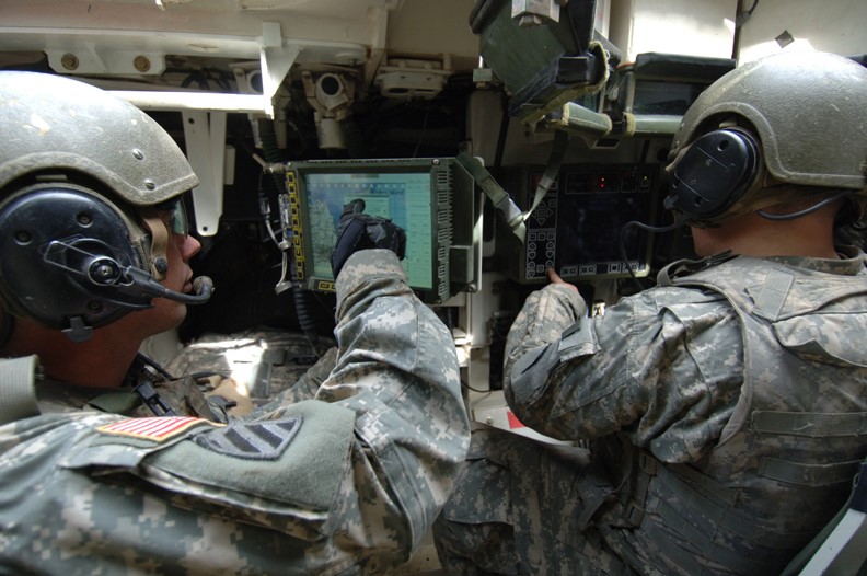 Soldiers with helmets and headsets pointing at screen illustrate blog "CMMC for Small Businesses: a Starter Kit"