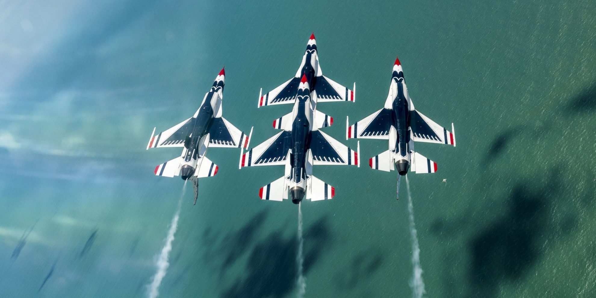 Thunderbirds perform at Cocoa Beach Three Thunderbird military planes painted red, white, and blue illustrate blog "ITAR: Who Is a U.S. Person?"
