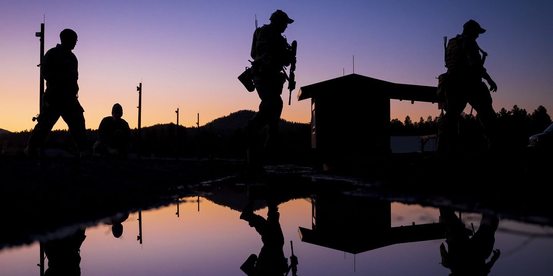 EmaiIITARData U.S. soldiers seen walking against the morning sky illustrate blog "Can You Email ITAR Data? "
